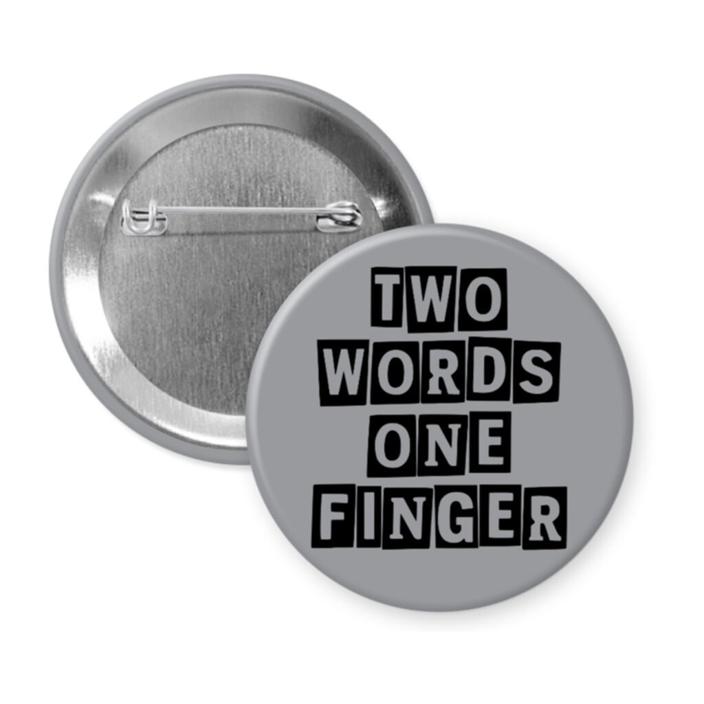 Grey pinback button with the text 'TWO WORDS ONE FINGER' printed in black stencil font.
