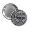 Grey pinback button with image of a line art moon and the text 'We are the granddaughters of the witches you couldn't burn' printed in black.