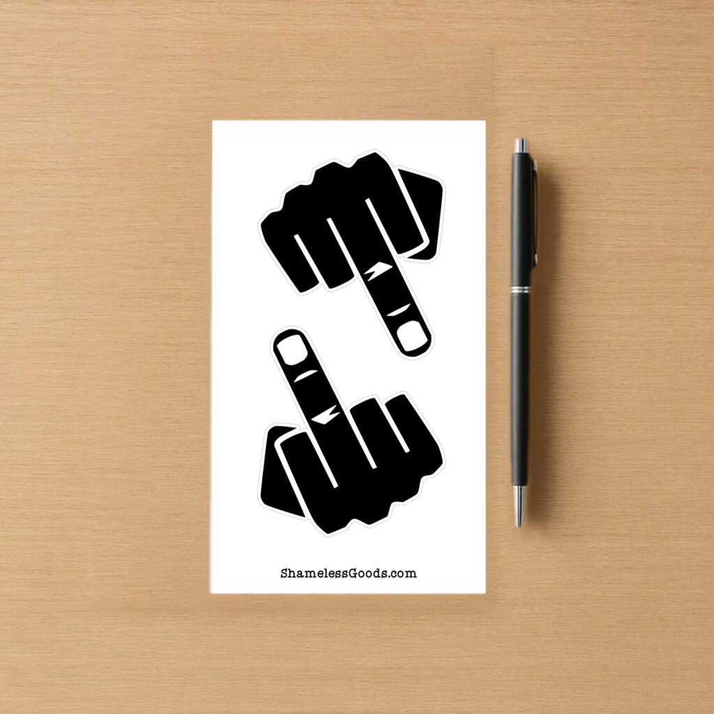 Sticker sheet with two black hand designs and ShamelessGoods.com branding on wood background.