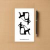Sticker sheet on a wooden surface beside a black pen, featuring two black silhouette BDSM‑themed designs showing dominant‑submissive poses with leash detail. Branding at bottom reads ShamelessGoods.com.