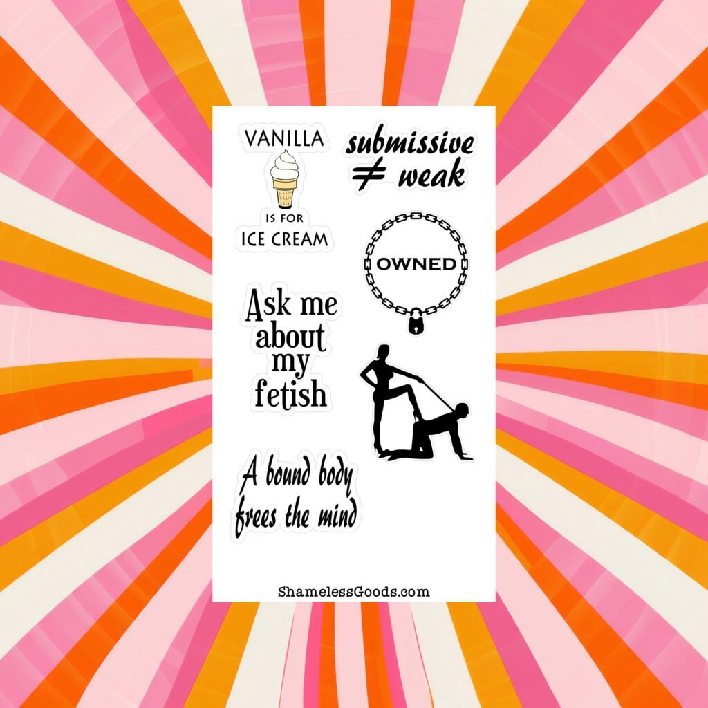 Sticker sheet on a wooden surface beside a black pen, featuring adult‑humor BDSM designs and phrases such as Vanilla is for ice cream, submissive ≠ weak, Ask me about my fetish, and a silhouette of a dominant‑submissive pose. Branding at bottom reads ShamelessGoods.com.