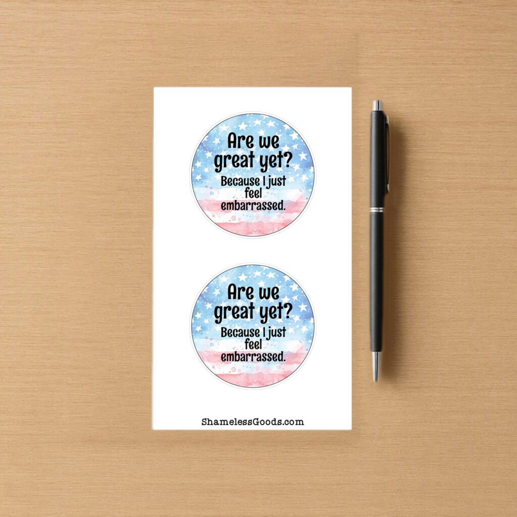 Sticker sheet with two round designs showing a watercolor American flag background and the text Are We Great Yet Because I just feel embarrassed.