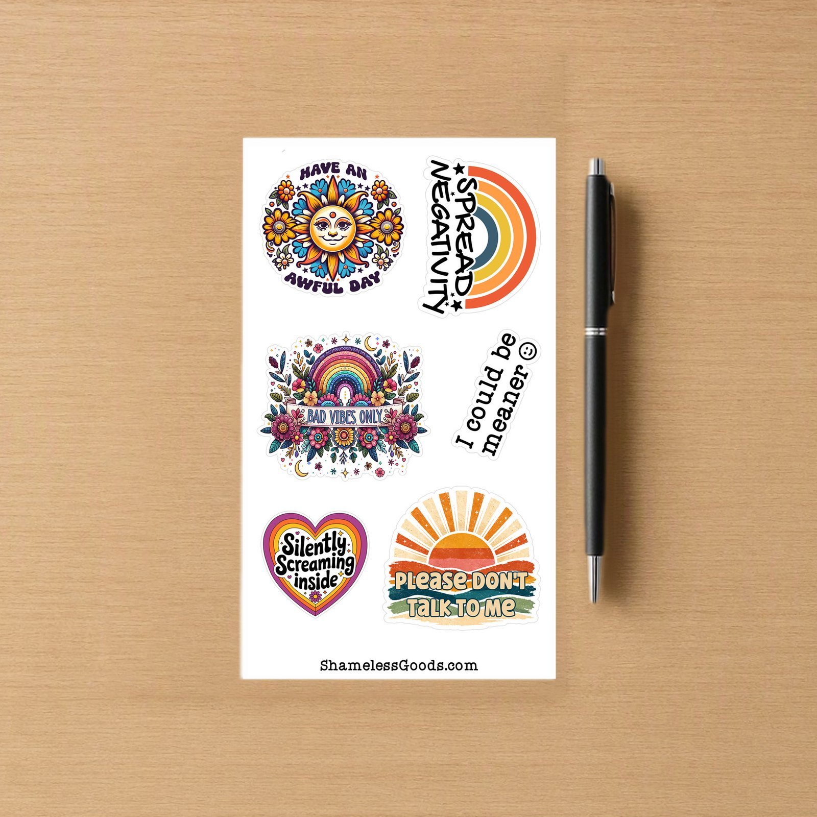 Sticker sheet with six colorful designs including a smiling sun with flowers, retro rainbow Spread Negativity, floral rainbow Bad Vibes Only, vertical I could be meaner text, heart Silently Screaming inside, and sunburst Please Don’t Talk To Me.